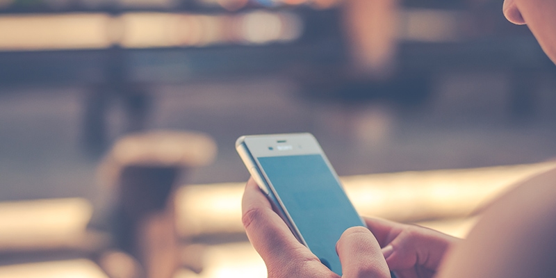 Girl using her mobile to contact someone. messaging texting sms