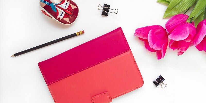 The best tools for bloggers security header image of bright pink notebook and flowers