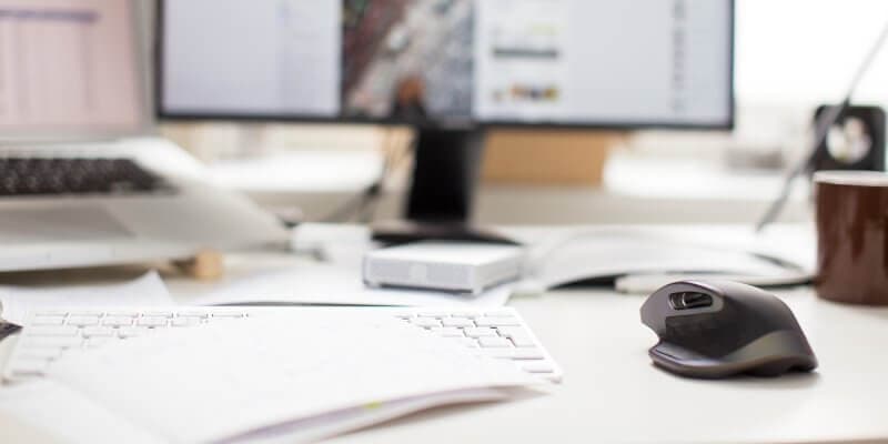 WordPress maintenance task comment moderation header image of keyboard and mouse on desktop