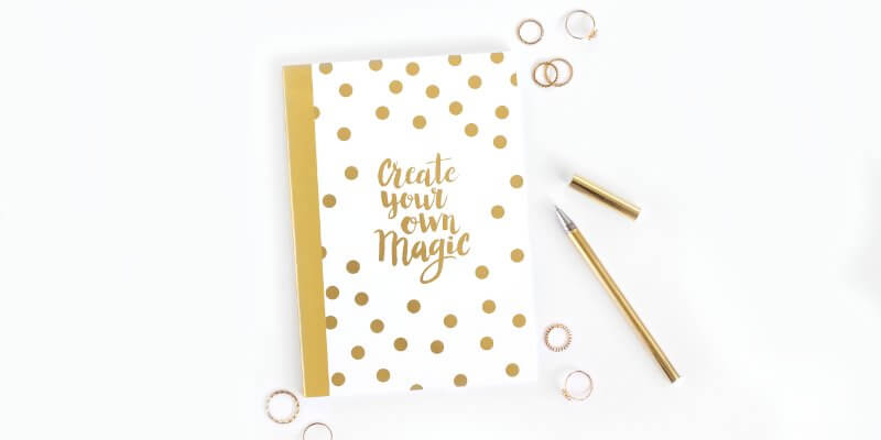 WordPress maintenance task test your website header image of white and gold notebook with pen
