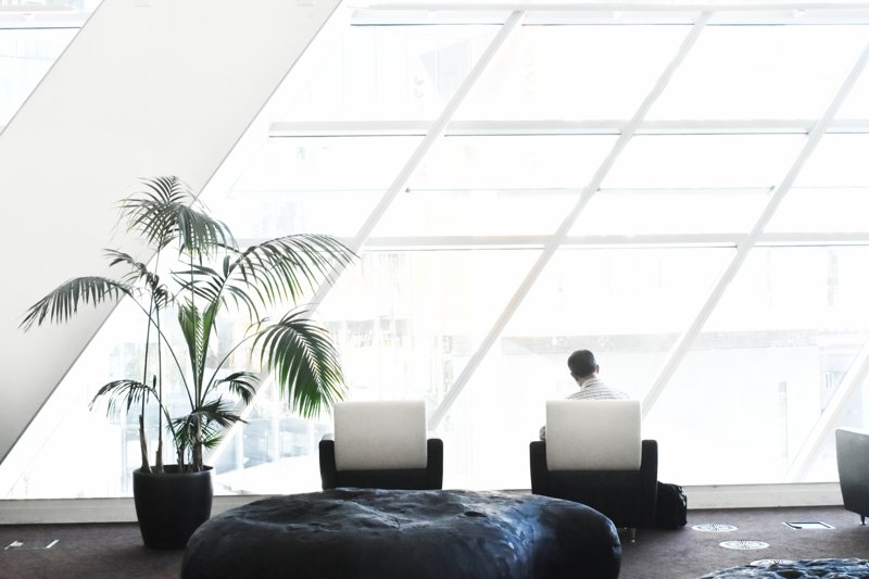 Wordpress Tips Tricks & Hacks Header Image Of A Man Sitting In A Chair At The Office
