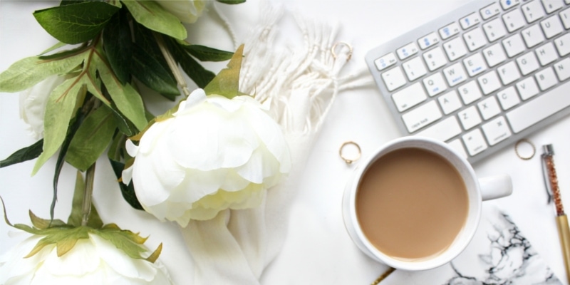 Why Use WordPress For Blogging Header Image Of White Rose Mug Of Coffee And Keyboard