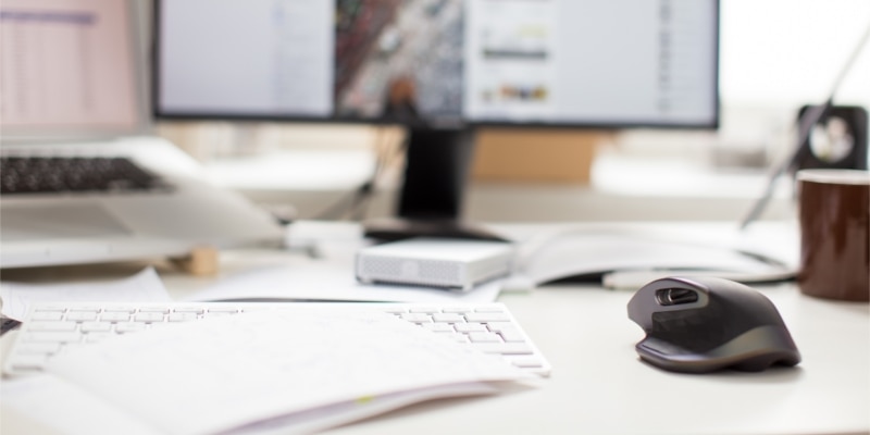 Wordpress Pinterest Plugins Header Image Of Desk With Monitors A Laptop And Other Office Supplies