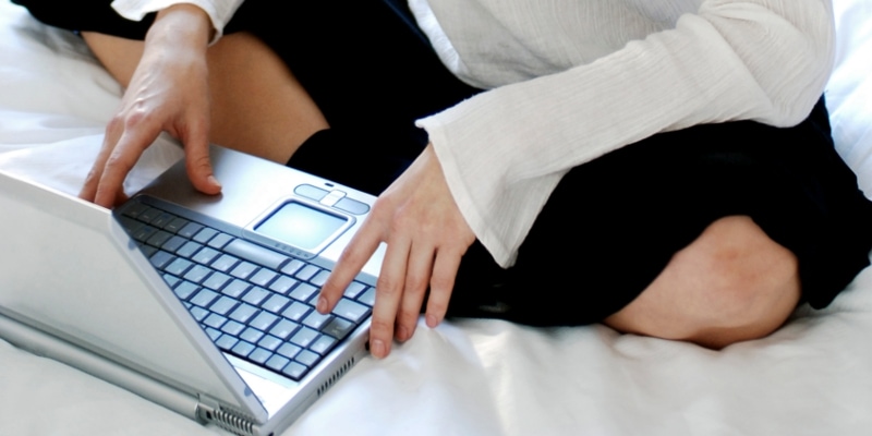 Female Blogger Checking Frequently Asked Questions About WordPress
