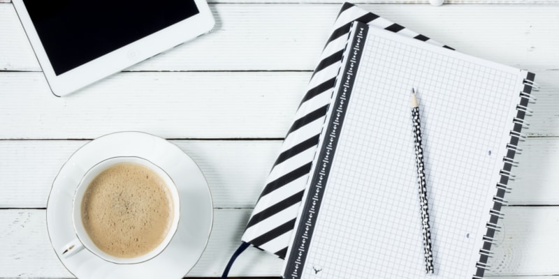 Bloggers Notebook Tablet And Coffee Ready To Write Blog Posts Fast