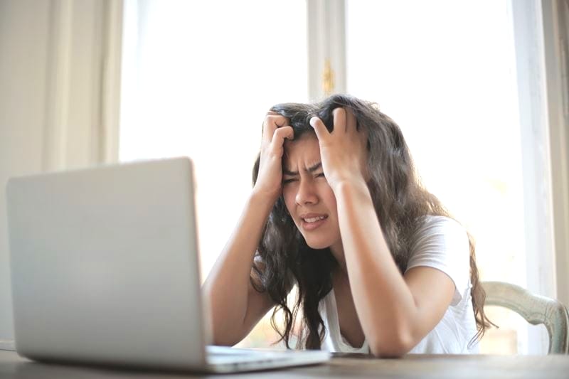How To Stay Motivated To Blog And Avoid Blogger Burnout Header Of Stressed Overwhelmed Blogger