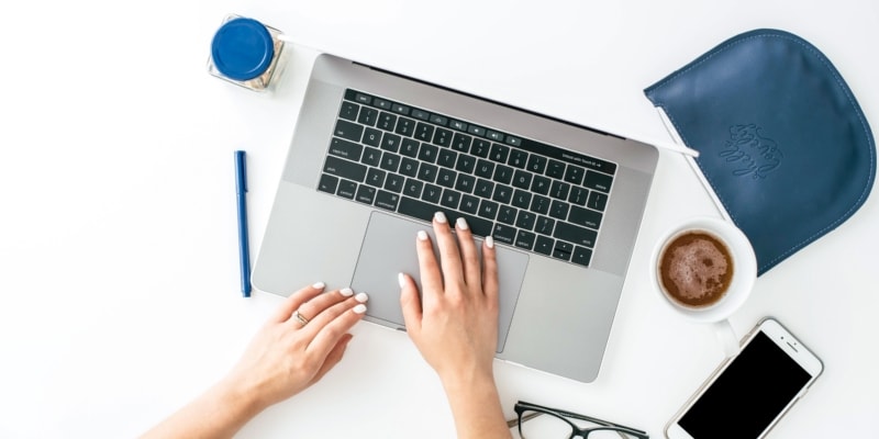 Female Blogger Using Laptop To Work On Their WordPress Blog