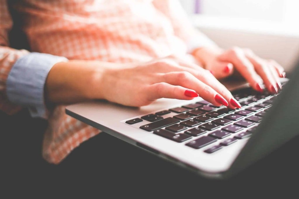 Hidden WordPress Gutenberg Features Header Image Of Woman Typing On A Laptop